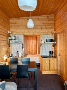 a room with a bed and a table with chairs at Kyly in Savonlinna +36 photos