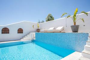 a villa with a swimming pool and a house at Casa Evita in Gennadi +83 photos