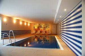 a pool in the middle of a house at Sun Island in Baabe