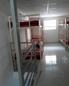 a room with several bunk beds in a building at eStay in Ho Chi Minh City