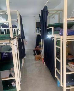 a room with several bunk beds in a dorm at eStay in Ho Chi Minh City