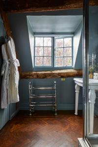 a bathroom with a sink and a window at The Porch House in Stow on the Wold +126 photos