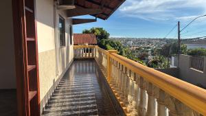 a balcony with a view of a city at Casa confort - Vicente pires in Brasília