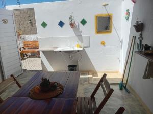 a room with a table and a sink in a room at Chale Canoa Beach in Canoa Quebrada
