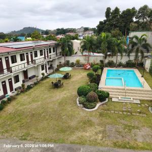 an aerial view of a yard with a swimming pool at DMS Apartelle in Los Baños