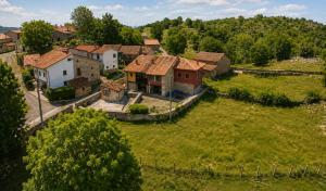 an aerial view of a small village with houses at Casa Rural La Eugenia · Picos de Europa · Cabrales in Puertas