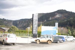 a group of cars parked in a parking lot at O Cruceiro da Ulla in Vedra