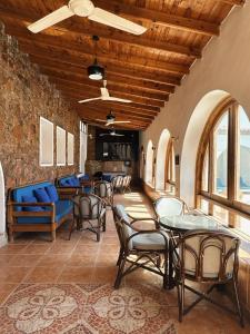 a room with tables and chairs in a building at Blue Beach Club in Dahab