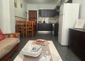 a kitchen and a living room with a table at Aguilon in Arrecife