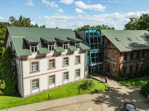 an aerial view of a building with a green roof at Hotel Sigulda in Sigulda