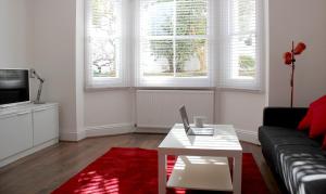 a living room with a couch and a coffee table at West Hill Apartment in Brighton & Hove