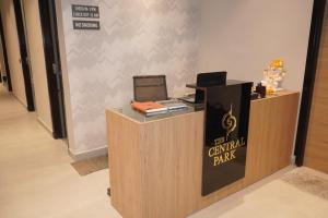 a lobby with a counter with a computer on it at HOTEL CENTRAL PARK in Bathinda
