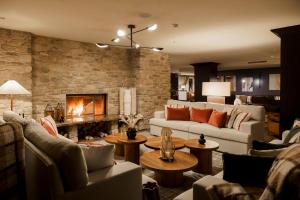a living room with couches and a fireplace at Chalet Valdotain in Breuil-Cervinia +56 photos