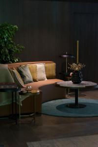 a living room with a couch and a table at Chalet Valdotain in Breuil-Cervinia