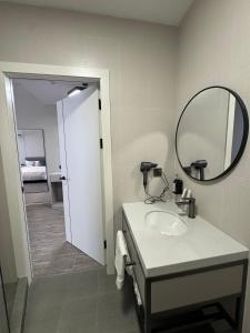 a bathroom with a sink and a mirror at Wind Rose in Almaty +25 photos