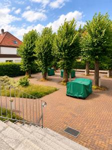 a tent is set up in a park with trees at Waldschloss Rathenow in Rathenow