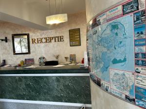 a large map on the wall in a room at Hotel Atlantis in Tulcea