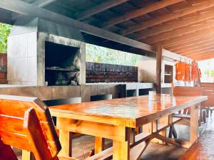 a wooden table and chairs in a kitchen at Fisherman's 6-Bedroom Family Home in St Lucia