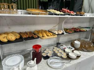a buffet with many different types of food on a table at Bella Hotel Navoi in Karmana