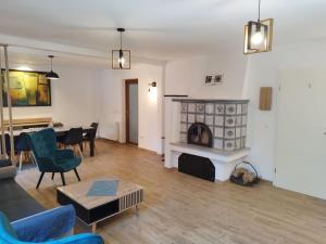 a living room with a couch and a fireplace at Casa Carolianne in Bran +61 photos