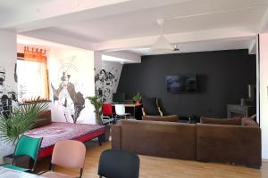 a living room with a couch and a table at Drenak Hostel in Skopje