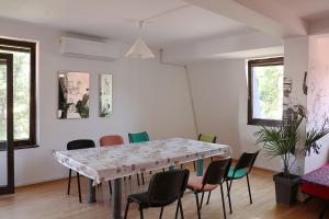 a dining room with a table and chairs at Drenak Hostel in Skopje