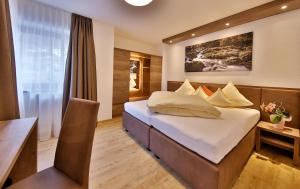 Posteľ alebo postele v izbe v ubytovaní Hotel Garni Fiegl Apart + 37 fotografií