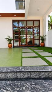 a lobby of a building with two potted plants at L2 Retreat in Kottakupam