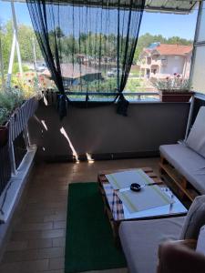 a living room with a couch and a table at Apartment TiBi in Kumanovo