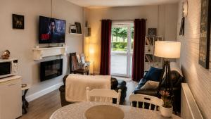 a living room with a couch and a table at Farm Lodge in Monaghan