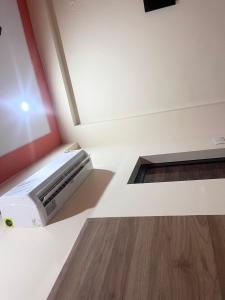 a room with a air conditioner and a window at Rao hotel in Jaipur