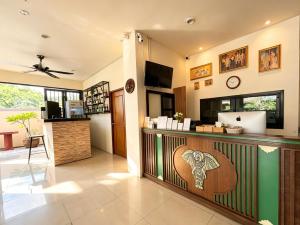 a restaurant with a bar with a counter at patong v hotel in Patong Beach