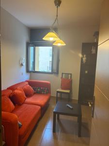a living room with a couch and a table at Plazacuervo in Pancorbo