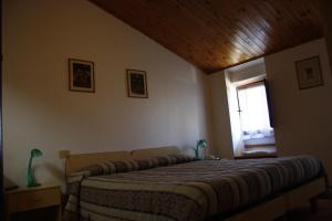 Postel nebo postele na pokoji v ubytování Hotel Bodoni