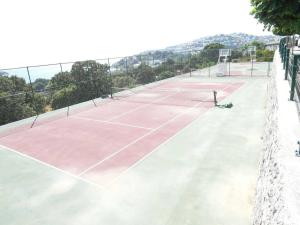 a tennis court with a net on top of it at Villa Matie Bodrum Views in Bodrum City
