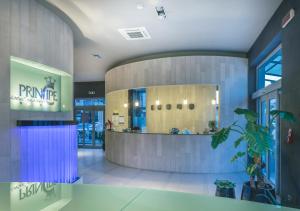 a lobby of a store with a counter in the middle at Hotel Principe Residence in Vasto