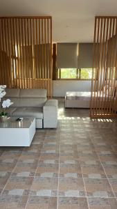 a living room with a couch and a table at Castle View in Qeparo