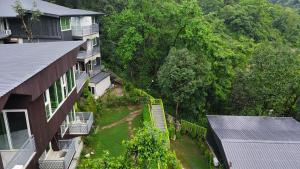 an aerial view of a house with a yard at Cottages & Cafe in Dogadda