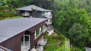 an overhead view of a house with a roof at Cottages & Cafe in Dogadda