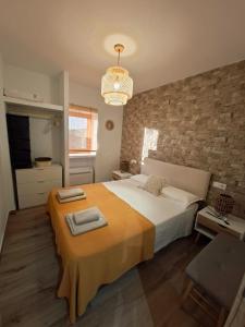 a bedroom with a large bed with two towels on it at Refugio Bella Luna in Ruidera +56 photos