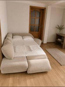 a large bed sitting in a room with at Солочин Квітка Полонини Дом 63 in Solochyn