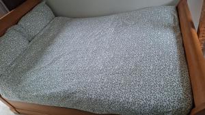 an empty couch with a gray and white pattern at Castle Room in Windsor