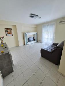 a living room with a couch and a fireplace at The Citrus Balcony in Trappitello