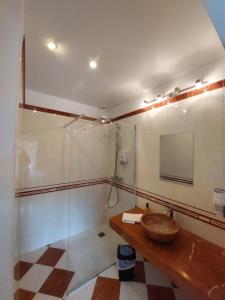 a bathroom with a sink and a mirror at Au Domelia Provinois - Chambres - in Cerneux