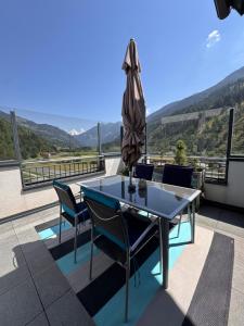 a table and chairs on a roof with a view at Apartment Sophia in Rangersdorf
