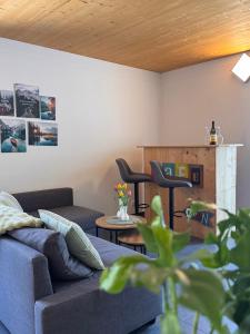 a living room with a couch and two chairs at Apartment Sophia in Rangersdorf