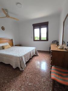 a bedroom with a bed and a window at Pedrera in Banyeres de Mariola +30 photos