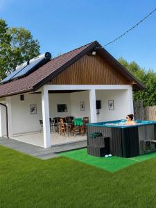 a house with a swimming pool in the yard at La Luca in Maliuc