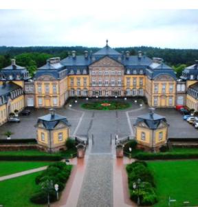 a large building with a courtyard in front of it at Chalet Muckelstübchen in Bad Arolsen