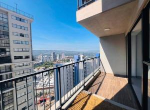 a balcony of a building with a view of a city at Conjunto Torres del Bosque-diagonal a la Foscal in Floridablanca